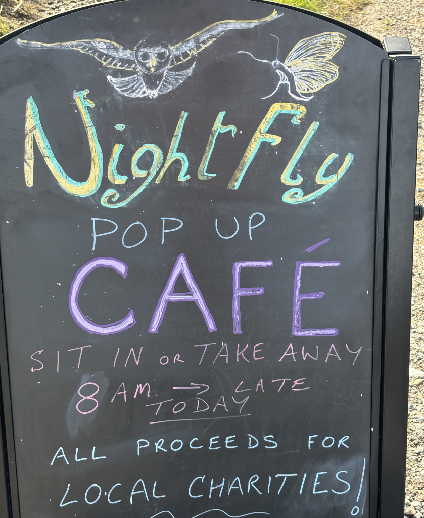 Board at roadside of pop-up cafe in Kilchoan